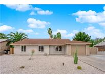 Charming single-story home featuring a desert-landscaped front yard and a neutral color scheme at 57 Marion Dr, Las Vegas, NV 89110