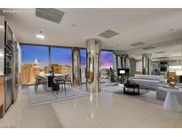 Modern living room with dining area, large windows showcasing city views, and sleek, contemporary finishes at 3726 Las Vegas Blvd # 2506, Las Vegas, NV 89158