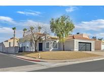 Charming single-story home featuring well-maintained landscaping and a two-car garage at 457 Leighann Rd, Henderson, NV 89015