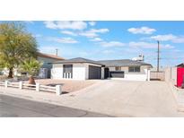Charming single-story home with a well-manicured front yard and a spacious driveway at 6320 Hobart Ave, Las Vegas, NV 89107