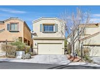 A charming two-story home with a well-maintained front yard and a two-car garage at 9148 Watermelon Seed Ave, Las Vegas, NV 89143