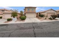 Charming two-story home featuring a two-car garage and low-maintenance landscaping at 11013 Napa Ridge Dr, Las Vegas, NV 89144