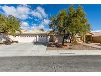 Charming single-story home featuring a spacious three-car garage and well-maintained front yard at 1114 Cedar Dove Rd, North Las Vegas, NV 89081