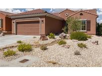 Charming single story home with low maintenance desert landscaping and a two car garage at 1407 Wheelwright Ct, Mesquite, NV 89034