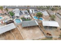Expansive property with horse facilities, covered stalls, and a refreshing in-ground pool for outdoor enjoyment at 1462 Rawhide St, Las Vegas, NV 89119