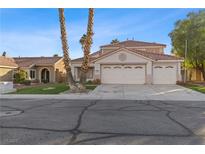 Charming single-Gathering home featuring a three-car garage and a well-maintained, low-water landscaped front yard at 1903 Ginger Blossom Ave, North Las Vegas, NV 89031