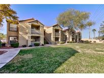 Inviting apartment complex with well-maintained landscaping and manicured lawn at 2300 E Silverado Ranch Blvd # 1037, Las Vegas, NV 89183