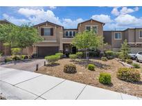 Charming two-story home featuring desert landscaping, a brick driveway, and a cozy balcony at 2833 Athena Hill Ct, Henderson, NV 89052
