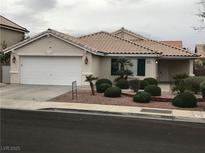 Charming single-story home with desert landscaping, two-car garage, and a well-maintained front yard at 331 Mount Hope St, Henderson, NV 89014