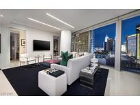 Modern living room featuring floor to ceiling windows with stunning city views and a large sectional sofa at 3726 S Las Vegas Blvd # 1107, Las Vegas, NV 89158
