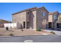Two-story stucco home with a two-car garage and low-maintenance desert landscaping at 5285 Bombazine St, Las Vegas, NV 89122