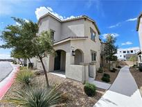 Charming stucco home featuring desert landscaping, a covered entrance, and a freshly painted exterior at 760 Crisp Morning Ct, North Las Vegas, NV 89086