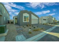 Charming single-story home featuring a modern architectural style with a well-manicured front yard at 10009 Locking Biner Ave, Las Vegas, NV 89166
