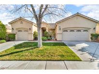 Charming single-story home with a well-manicured lawn and a three-car garage at 10705 Arundel Ave, Las Vegas, NV 89135