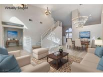 Bright living room with modern decor and a view of the staircase and dining area at 1700 Wandering Winds Way, Las Vegas, NV 89128
