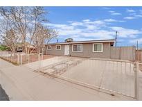 Charming single-story home with fenced yard and covered driveway, providing both privacy and curb appeal at 3305 Palomar St, North Las Vegas, NV 89030