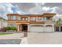 Elegant two-story home with a three-car garage and beautiful architectural details at 6491 Bright Nimbus Ave, Las Vegas, NV 89139