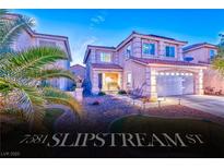 Charming two-story home with a two-car garage and well-manicured front yard at 7581 Slipstream St, Las Vegas, NV 89139