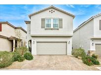 Attractive home with a neutral color scheme, charming window shutter and nicely landscaped front yard at 8432 Alder Rain St, Las Vegas, NV 89113