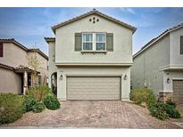 Charming two-story home featuring a two-car garage and well-maintained front yard landscaping at 8432 Alder Rain St, Las Vegas, NV 89113