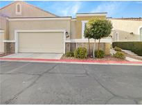 Charming home featuring a two-car garage, neutral colors, and well-maintained landscaping at 1001 Collingtree St, Las Vegas, NV 89145