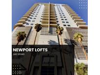 Striking exterior view of the Newport Lofts high-rise in Las Vegas with modern architectural design and palm trees at 200 Hoover Ave # 1507, Las Vegas, NV 89101
