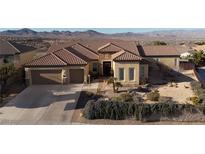 Charming single-story home featuring a well-manicured desert landscape and attached two-car garage at 2401 Orangeburg Pl, Henderson, NV 89044
