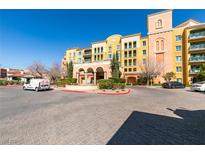 Beautiful condo community featuring desert landscaping and colorful architecture against a clear blue sky at 30 Strada Di Villaggio # 521, Henderson, NV 89011