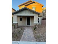 Charming home featuring a welcoming front porch and a paved walkway leading to the entrance at 3160 Del Dotto Walk, Henderson, NV 89044