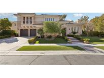 Elegant two-story home with manicured front yard and mature landscaping at 3863 Glasgow Green Dr, Las Vegas, NV 89141