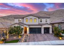 Elegant two-story home with a three-car garage, landscaped front yard, and mountain views at 3929 Reyes Ave, Las Vegas, NV 89141