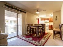 Cozy living room with dining area and a sliding glass door to the balcony at 4411 Alexis Dr # 444, Las Vegas, NV 89103
