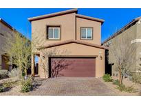 Charming two-story home featuring a brick driveway and a two-car garage at 5236 Sunstone Mesa Dr, Las Vegas, NV 89166
