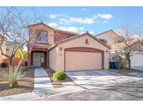 Charming two-story home featuring a two-car garage and low maintenance landscaping in a residential neighborhood at 6697 Boom Town Dr, Las Vegas, NV 89122