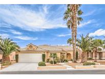 Charming single-story home featuring desert landscaping, a two-car garage, and an inviting entryway with desert landscaping at 7613 Falconwing Ave, Las Vegas, NV 89131