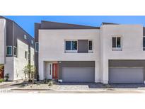 Modern two-story home boasts a neutral palette and sleek design with a two-car garage at 8629 Ensworth St # 112, Las Vegas, NV 89123