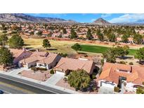 Expansive aerial view of the home, showcasing the beautiful desert landscaping and nearby golf course at 9524 Sundial Dr, Las Vegas, NV 89134