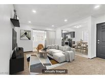 Bright living room featuring a modern sectional, stylish decor, and lots of natural light at 1390 Vegas Valley Dr # 32, Las Vegas, NV 89169
