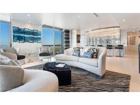 Bright living room featuring elegant furnishings, city views, and statement chandelier at 200 W Sahara Ave # 4101, Las Vegas, NV 89102