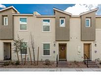 Charming townhome featuring a modern facade with stone accents and a welcoming front door at 5615 Distelrath Ave, Las Vegas, NV 89122