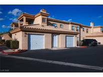 Charming townhome with two-car garage and well-maintained landscaping at 6700 Amarinta Ave # 104, Las Vegas, NV 89108