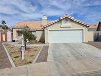 Charming single-story home featuring a two-car garage and a well-maintained front yard at 7828 Silver Mallard, Las Vegas, NV 89131