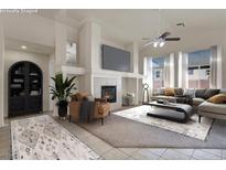 Bright living room featuring a cozy fireplace, comfortable seating, and neutral decor at 1006 Christopher View Ave, North Las Vegas, NV 89032