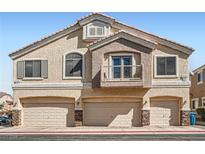 Inviting townhome featuring a private balcony and three-car garage, perfect for comfortable living at 1142 Heavenly Harvest Pl # 2, Henderson, NV 89002