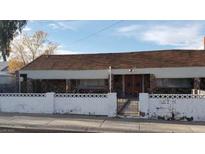 Charming single-story home with stone accents, and a well-maintained white fence for privacy at 116 Continental Ave, Henderson, NV 89015