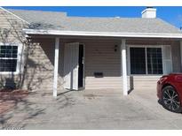 Inviting single-story home with a covered porch, well-maintained siding, and an open front door at 1315 Wengert Ave, Las Vegas, NV 89104