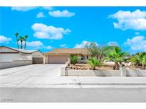 Charming single story home with desert landscaping and a spacious driveway at 2302 Wagonwheel Ave, Las Vegas, NV 89119