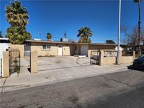 Charming single-story home with desert landscaping, gated front yard and private driveway at 2746 E Owens Ave, North Las Vegas, NV 89030