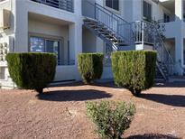 Exterior shot with attractive, manicured landscaping near building access stairs at 3318 N Decatur Blvd # 1056, Las Vegas, NV 89130