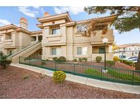 Multi-level condo building featuring tan stucco, terracotta roof tiles, and well-maintained landscaping at 354 Sunward Dr # 0, Henderson, NV 89014